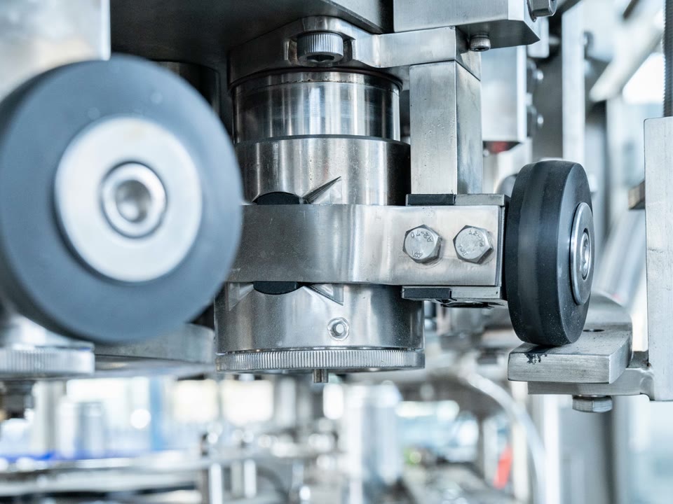 Close-up of the stainless steel can seaming station